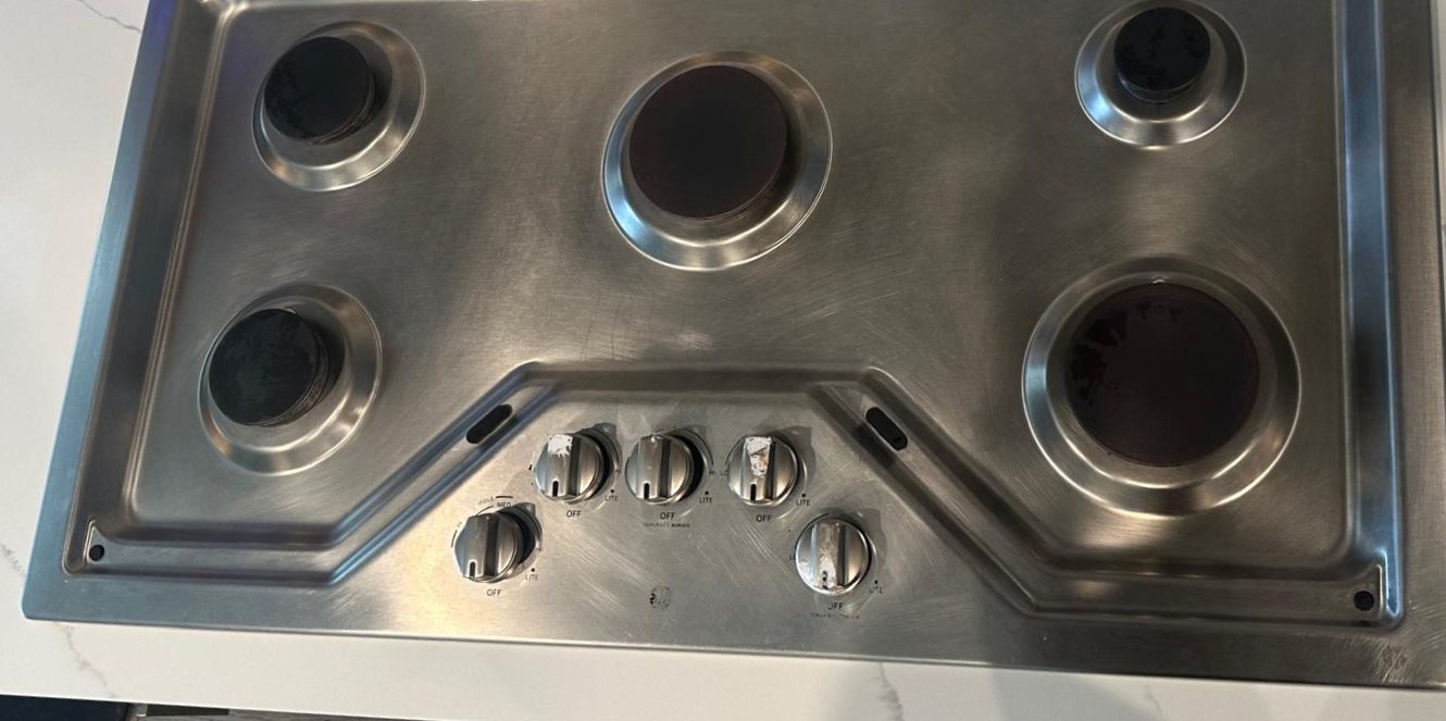 Stainless cooktop after cleaning, clean and shiny
